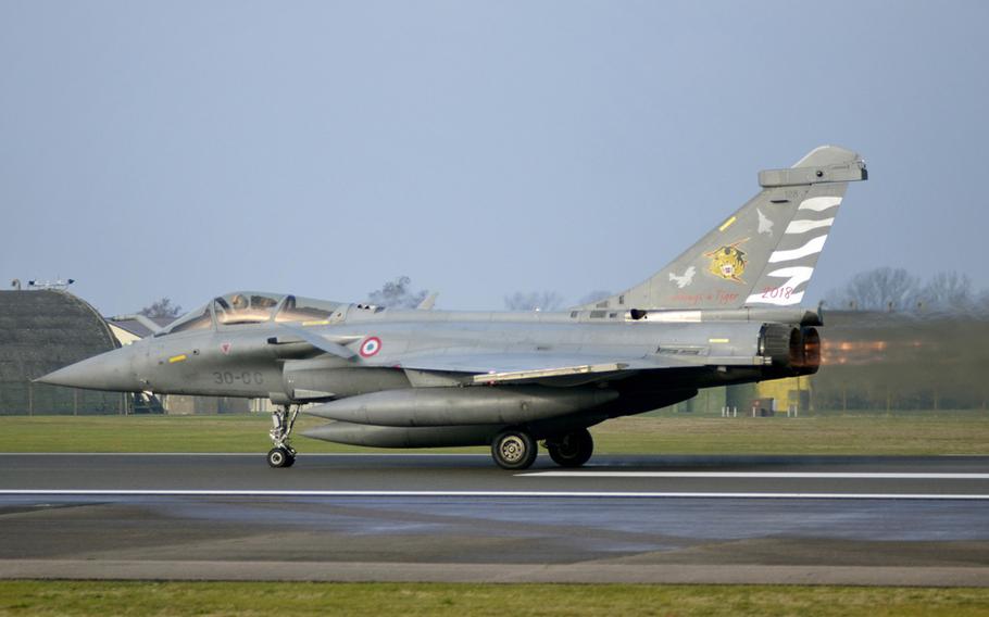 A French Rafale fighter jet takes off from RAF Lakenheath, England, during Exercise Point Blank, Tuesday, Nov. 27, 2018. About 250 airmen, 26 fighter jets and various support aircraft from three NATO allies are taking part in the largest war game of its kind in the U.K.