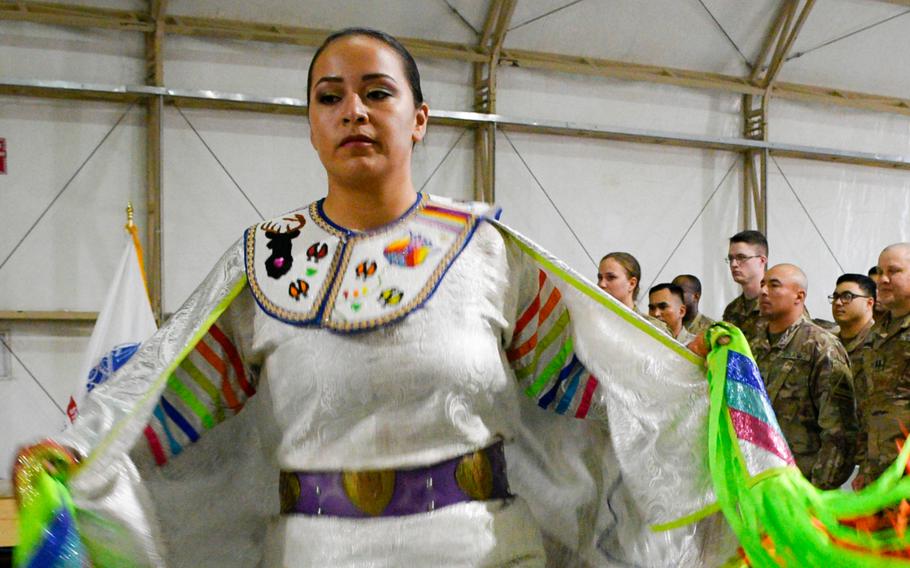 Army Pfc. Loretta Menchaca, 21, dances during a powwow at Camp Buehring in Kuwait Nov. 27
