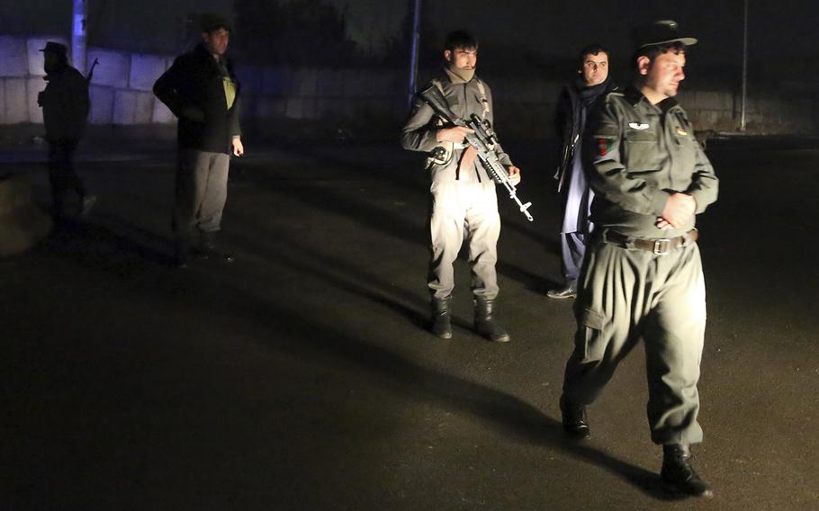 Security forces block the roads at the site of a suicide bomb attack in Kabul, Afghanistan, Wednesday, Nov. 28, 2018. Najib Danish, spokesman for Afghanistan's Interior Ministry, said the attack in Kabul took place when a suicide bomber detonated his explosives and then other insurgents started a gun battle with forces in the area.