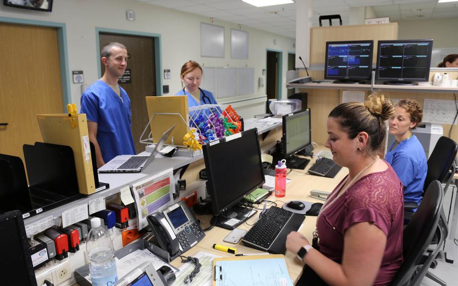 A mix of civilian and military workers staff the intake desk at the emergency room of Landstuhl Regional Medical Center. A recent GAO study outlined the difficulties the military has with shortages of civilian medical workers and recommended steps to address the issue.