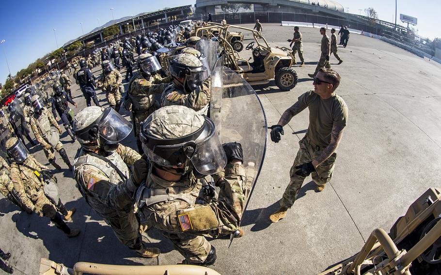 In a December 18, 2018 file photo, soldiers with 93rd Military Police Battalion, Special Purpose Marine Air-Ground Task Force 7, simulate resistance during civil disturbance training with U.S. Customs and Border Protection (CBP) at the Otay Mesa Port of Entry, Dec. 16, 2018.