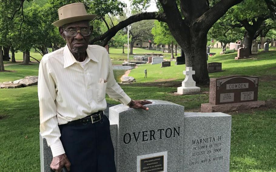 Richard Overton standing at his cousin Volma Overton's grave in the Texas State Cemetery in Austin. Richard Overton, a World War II veteran, will be buried Saturday in the cemetery just to the left of his cousin.