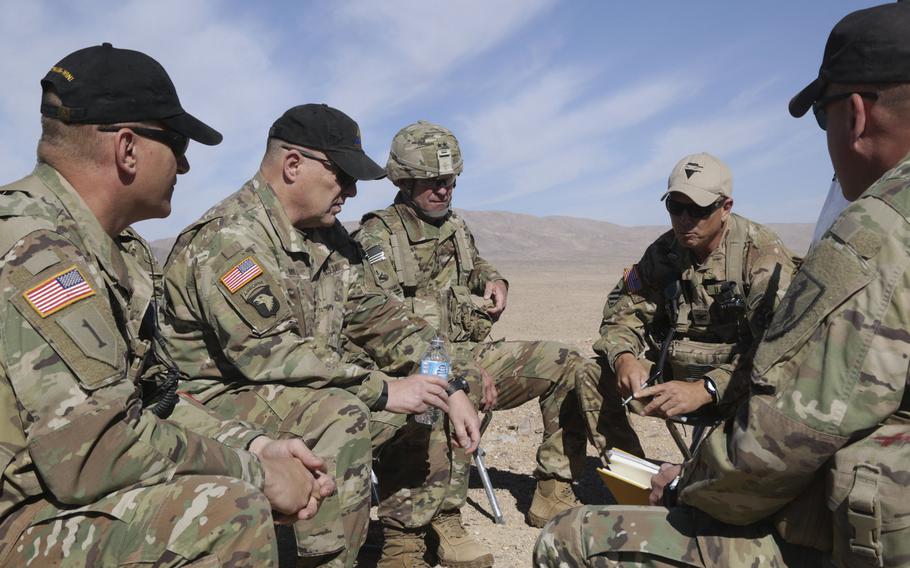 U.S. Army Chief of Staff Gen. Mark A. Milley, second from the left, visits with soldiers from the 1st Armored Division at the National Training Center at Fort Irwin, Calif., in 2016. Milley said Wednesday a push is under way to send more units to the National Training Center in Fort Irwin, Ca. and a similar center in Hohenfels, Germany.