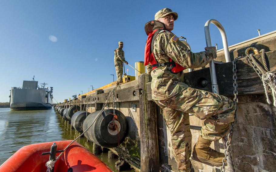 Spc. Dylan Nice, a U.S. Army Reserve watercraft operator from the 949th Transportation Company, a unit which specializes in watercraft operations, cargo and watercraft engineering, climbs a ladder from a rescue boat for a series in Baltimore in April 2017. The Army is considering shuttering its National Guard and Reserve mariner units.
