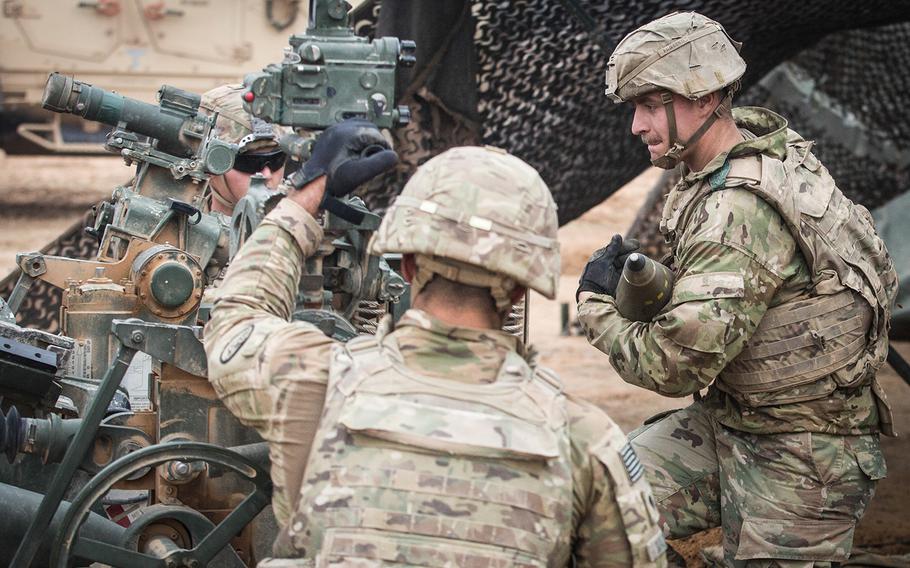 A U.S. Army soldier assigned to the 3rd Cavalry Regiment carries a 155mm artillery shell as his section prepares to fire an M777 howitzer on Firebase Saham, Iraq, on Dec. 2, 2018. The 3rd Cavalry Regiment is part of Combined Joint Task Force - Operation Inherent Resolve, supporting partner forces as they clear the last remaining pockets of ISIS from the Middle Euphrates River Valley and prevent them from fleeing into Iraq.