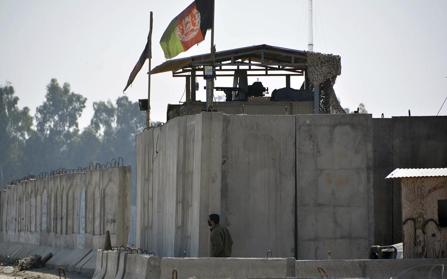 Afghan security personnel stand guard in the checkpoint of airport after a suicide attack in Jalalabad province, east of Kabul, Afghanistan, Wednesday, March 6, 2019.
