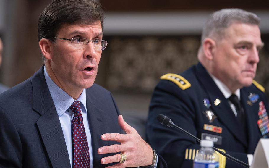 Army Secretary Mark Esper testifies before the Senate Armed Services Committee on Tuesday, March 26, 2019, during a hearing on Capitol Hill in Washington. Also testifying at right is Army Chief of Staff Gen. Mark Milley .