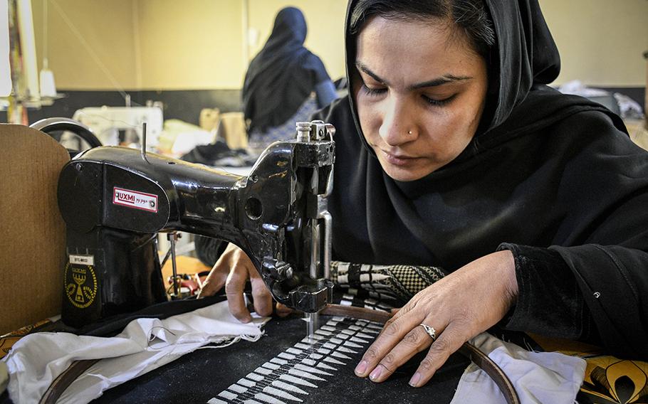 Farahnaz, a worker at a factory in Kabul, sews a shemagh for Combat Flip Flops, a company started by a U.S. veteran and Ranger who deployed to Afghanistan and wanted to invest in the country. Farahnaz asked to be named by her first name, as she worries for her safety in working as a woman in Afghanistan.
