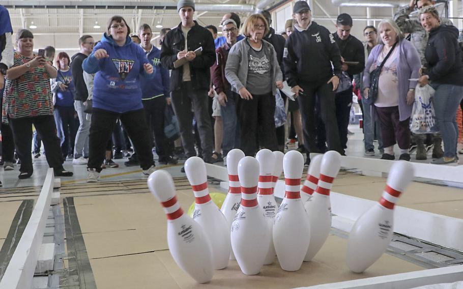 Katie Warrent, from Norwich, England, bowls a strike during the 38th Annual Joan Mann Sports Day, held Sept. 27, 2019 on RAF Mildenhall.