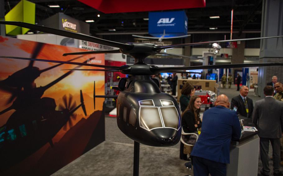 A static display shows a model of the Sikorsky-Boeing SB-1 Defiant at the annual AUSA convention in Washington, D.C., on Oct. 15, 2019. The compound helicopter has two coaxial rotors on top for vertical liftoffs and landings as well as a propeller in the rear for forward thrust. The Army announced in the last week of March 2020 that Bell of Fort Worth and Sikorsky Aircraft Corp. of Connecticut have been selected to move forward with attack reconnaissance aircraft prototypes under the vertical lift program.