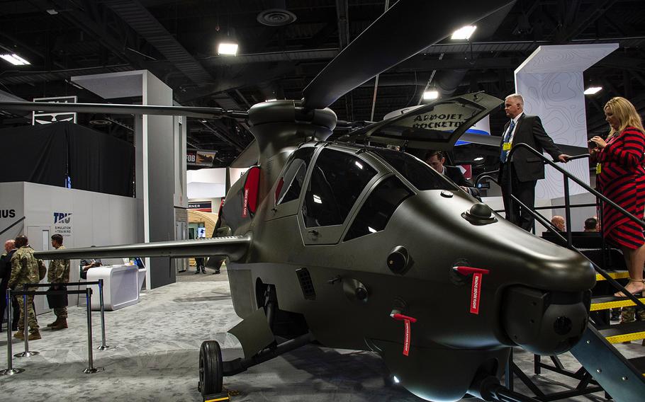 A static display of the proposed Bell 360 Invictus helicopter draws crowds at the 2019 AUSA convention in Washington, D.C., on Tuesday, Oct. 15, 2019. The relatively small and sleek frame was designed to fit the Army's bid for a Future Attack Reconnaissance Aircraft.