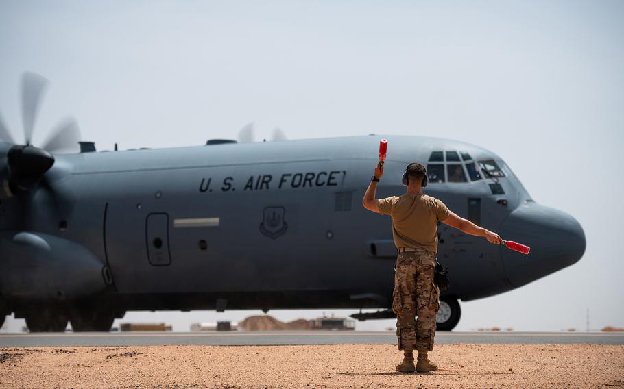 U.S. Air Force Tech. Sgt. Daniel Peterson marshals a C-130J Super Hercules at Nigerien Air Base 201, Agadez, Niger, on Aug. 3, 2019. The U.S. Air Force has expanded its mission out of the base with the start of drone operations, U.S. Africa Command said Friday, Nov. 1, 2019.