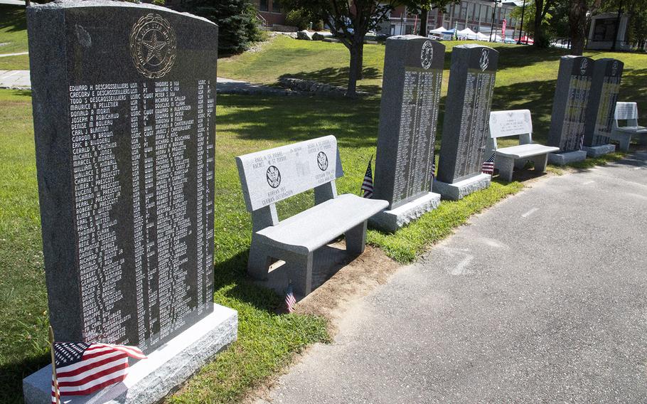 Memorial benches are placed between stones listing Lewiston-Auburn veterans at the Veterans Memorial Park in Lewiston, Maine, in August, 2019.