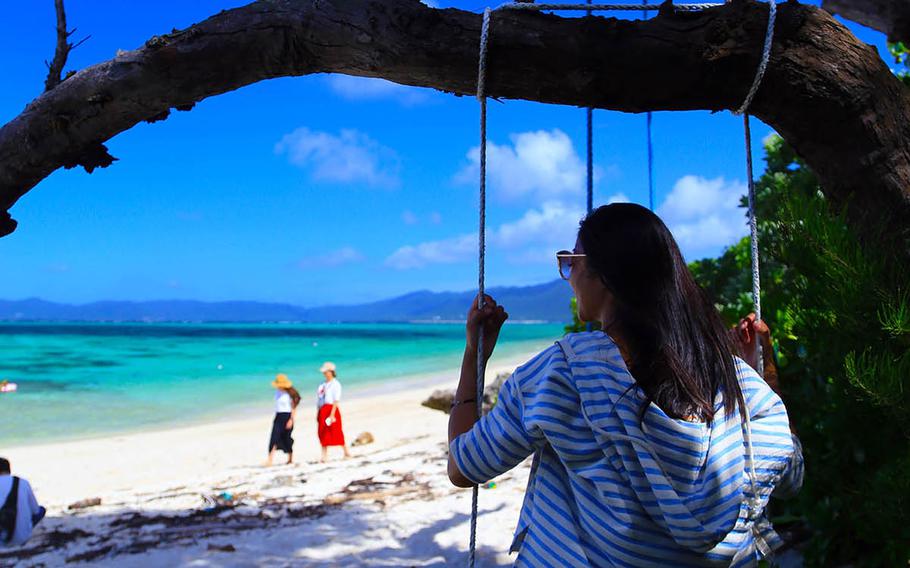 Enjoy a swing and some shade at a nameless beach near Kabira Bay, Ishigaki Island, Japan. 