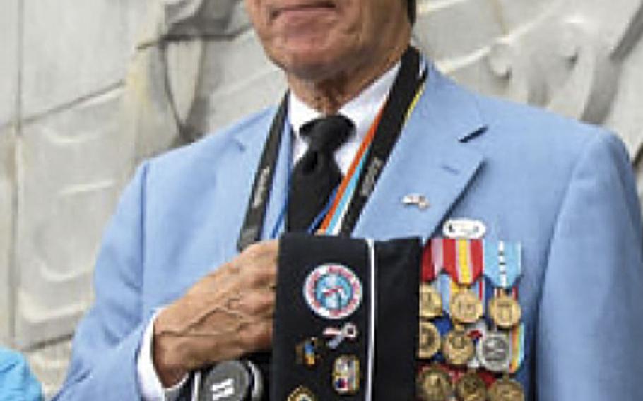 Charles Garrod, 73, stands during the playing of the South Korean national anthem during a ceremony marking the 57th anniversary of the Inchon landing.