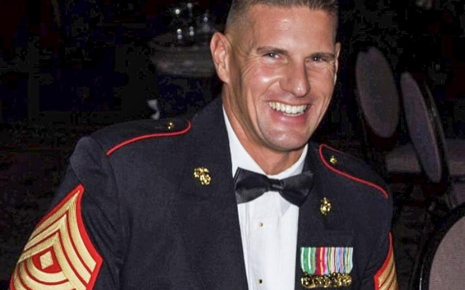 Kelly Murphy is pictured during his 22 years of service in the Marine Corps. Now a veteran, Murphy is one of 12 competitors on a new reality show, Tough As Nails, which debuts on CBS television on Wednesday, July 8, 2020. 
