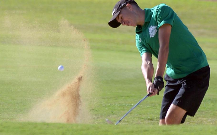 Kubasaki senior Bryce Tobin blasts out of a sand trap approaching the green on the 503-yard, par-5 10th hole.
