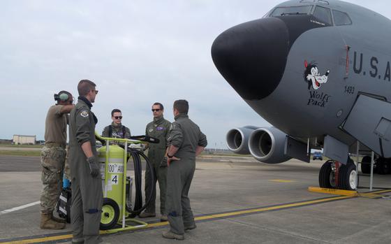 Airmen assigned to the 100th Air Refueling Wing discuss their emergency evacuation plan prior to participating in a large-force exercise at RAF Mildenhall, U.K., May 27, 2020.

