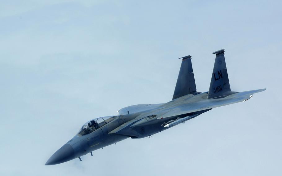 A U.S. Air Force F-15 Strike Eagle, assigned to the 48th Fighter Wing, RAF Lakenheath, U.K., peels away from a KC-135 Stratotanker, assigned to the 100th Air Refueling Wing, RAF Mildenhall, during a large-force exercise over the North Sea, May 27, 2020.
                