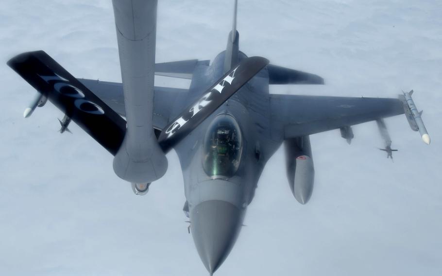 A U.S. Air Force F-16 Fighting Falcon, assigned to the 31st Fighter Wing, Aviano Air Base, Italy, prepares to receive fuel from a KC-135 Stratotanker, assigned to the 100th Air Refueling Wing, RAF Mildenhall, U.K., during a large-force exercise over the North Sea, May 27, 2020. 
                