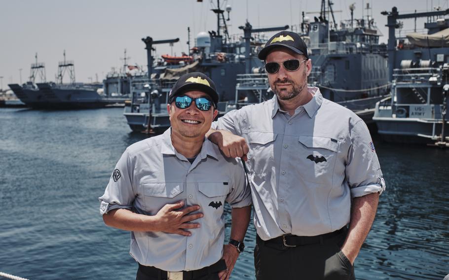 Jim Lee, DC chief creative officer, publisher and artist, and Tom King, Batman comic book writer, visit military ships on the Camp Patriot base in Kuwait on May 30.
                