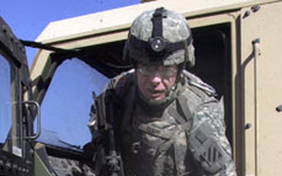 Spc. William Clapp III hops out of the driver’s seat at Combat Outpost Apache in northeast Baghdad. Clapp drove a commercial flatbed truck as a civilian; now he drives an armored truck. Clapp is one of several soldiers who has deployed after the Army raised its maximum enlistment age to 42.                                    