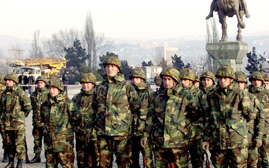 Some of the 400 Georgian soldiers that completed commando training as part of the U.S. European Command’s Georgia Train and Equip Program wait Sunday for a review before U.S. and Georgian military and government officials.