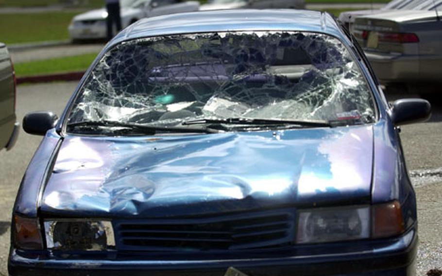Typhoon damaged cars are a common sight on all bases in Guam.