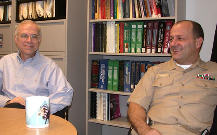 Dr. Larry Hale, department chief of the enteric infections at Walter Reed's Army Institute of Research, and Capt. Stephen Savarino, leader of the enterotoxigenic E. coli bacteria studies at the Naval Medical Research Center, a combined facility in Silver Spring, Md., talk about three types of vaccines that military doctors and scientists are working on to combat diarrhea for warfighters.