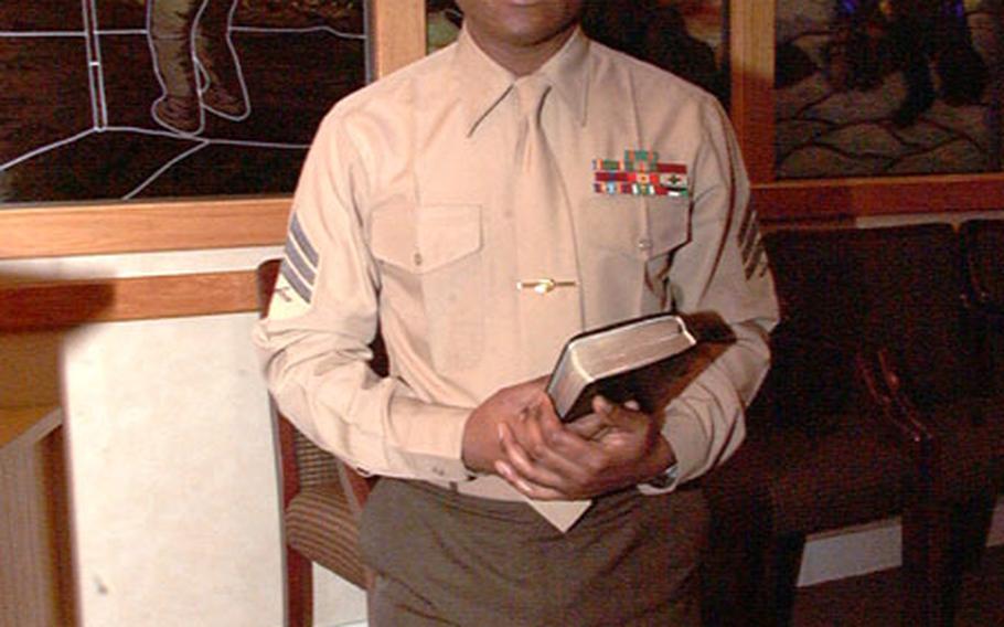 Sgt. Earl Lopez, 30, kneels for a photograph in the third-floor prayer room at the Pentagon. Lopez wants to become a Roman Catholic priest once he separates from the Marine Corps in two years. Since age 17, Lopez has been tugged by "the calling" to join the priesthood, an emotion he first fought.