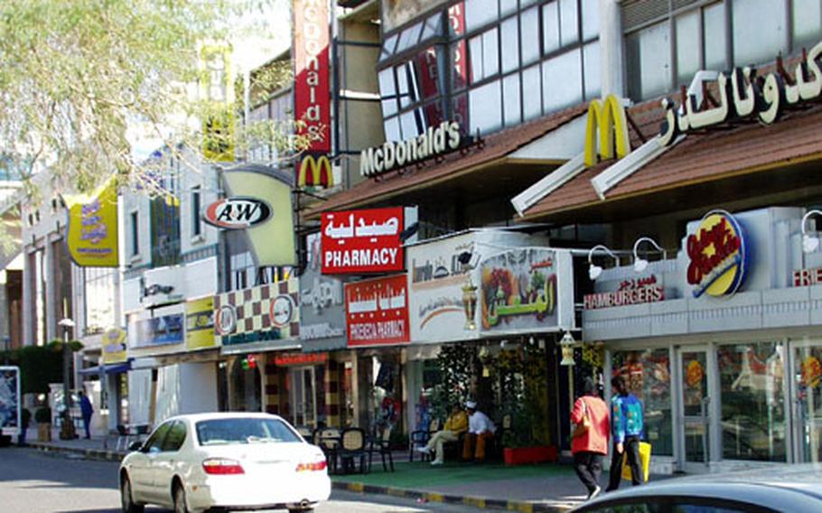 A smorgasbord of American food joints lines a block in Kuwait City.
