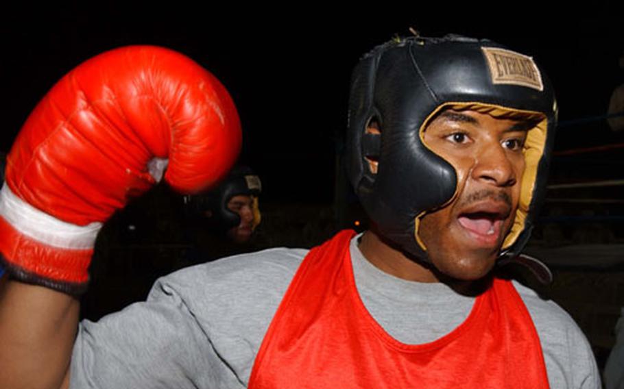 Staff Sgt. Laney Robinson, of the 3rd Infantry Division's 2nd Brigade Combat Team, prepares to enter the ring.