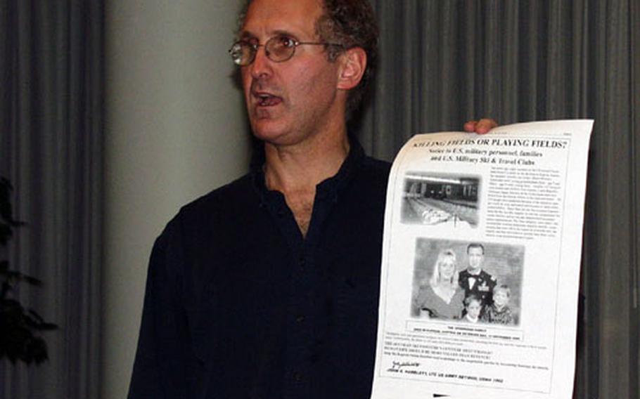 Ed Fagan, an American attorney who has filed a class-action lawsuit on behalf of the families of the victims of the Kaprun ski train disaster, holds up a copy of an advertisement that appeared in the Stars and Stripes, while speaking to Austrians who lost loved ones in the tunnel fire. Fagan said similar advertisements have appeared in a Slovenian newspaper and that a German ski magazine would join the ranks soon.