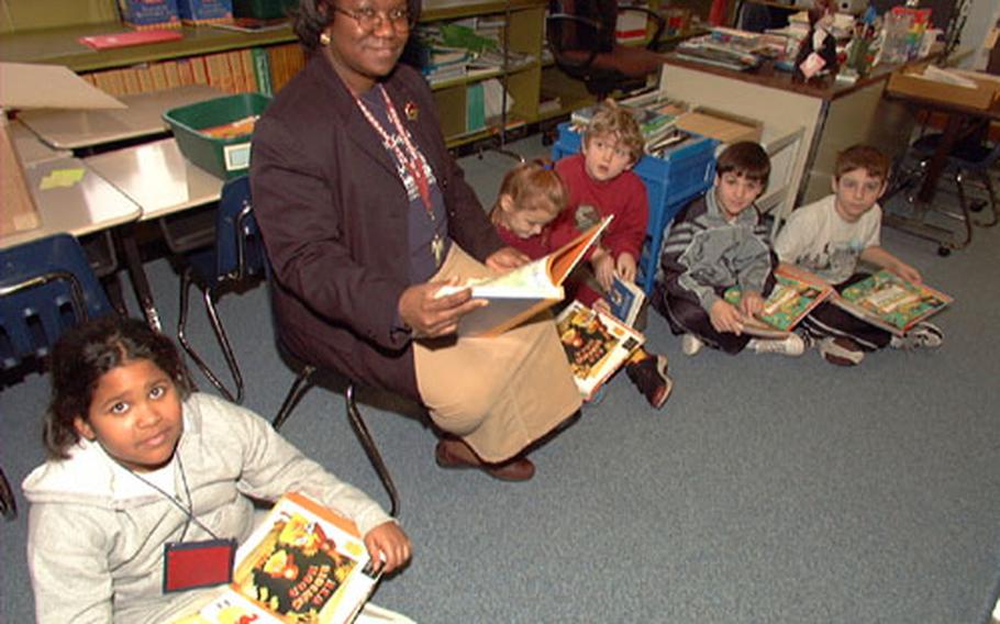 Patricia Wilson’s second and third grade class participates in story time on Friday. The four remaining teachers at the school have taken on multiple grades in their classrooms until the students all relocate to Vilseck and Hohenfels on Jan. 27.