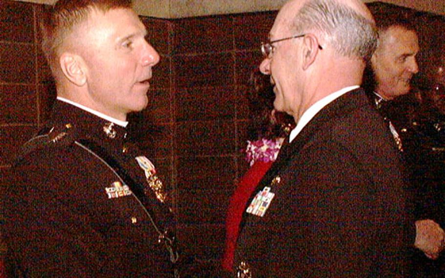The Marine Corps’ 33rd commandant, Gen. Michael Hagee, left, greets Chief of Naval Operations Adm. Vern Clark on Monday in Annapolis, Md.