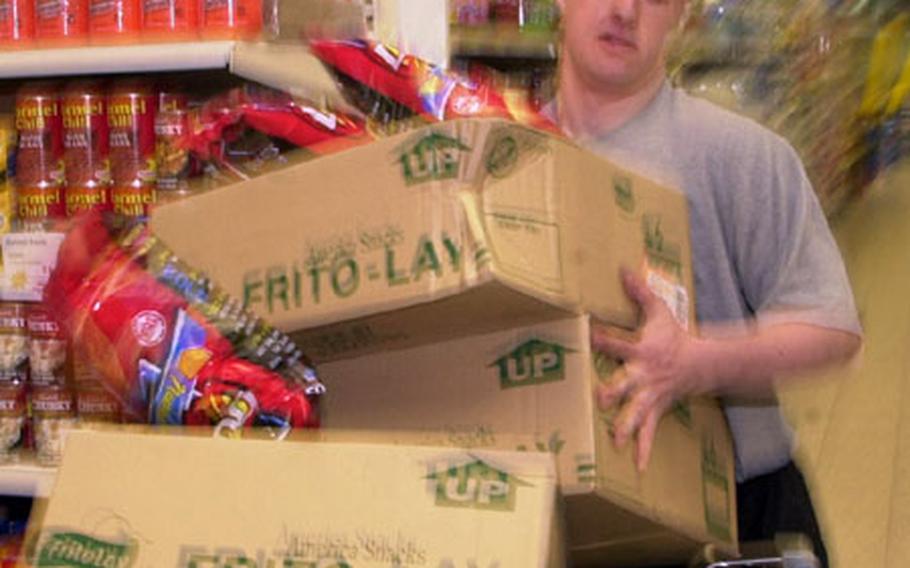 Spc. Justin Brown found out it's hard work filling 30 grocery carts in five minutes. Brown got a five-minute shopping blitz Friday morning at Baumholder's commissary, part of his being selected U.S. Army Soldier of the Year.