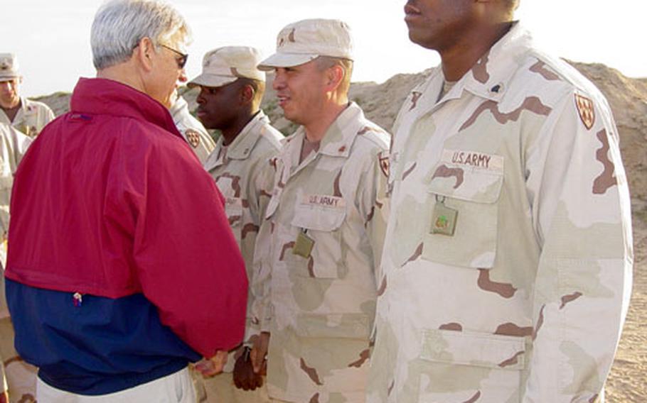 U.S. Undersecretary of the Army Les Brownlee meets with soldiers Thursday at a Patriot missile battery at Al Jaber Air Base, Kuwait.
