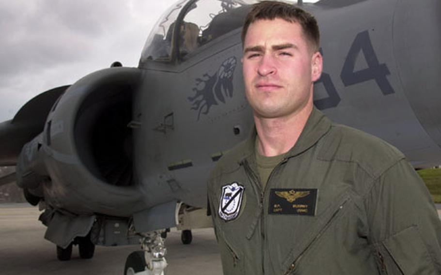 Marine Capt. Michael Murphy of Marine Attack Squadron 214, the Black Sheep Squadron, stands before an AV-8B Harrier at Kadena Air Base.