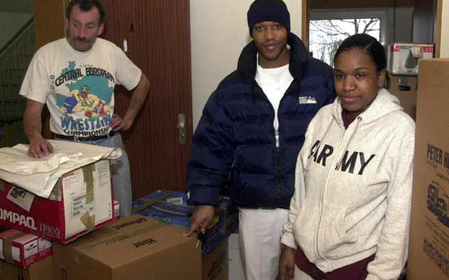 As a German mover packs up their household goods in December, Spc. Paqueshia Williamson and her husband, Sean Williamson, right, hope that quarters with better ventilation will end the family’s year-long battle with mold. The Williamsons got an exception to policy after Baumholder officials declared their quarters unfit for habitation.
