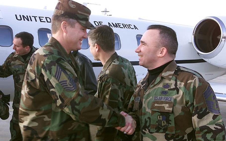 52nd Fighter Wing Command Chief Master Sergeant Kenneth J. McQuiston, right, greets Chief Master Sergeant of the Air Force Gerald R. Murray during his visit to Spangdahlem Air Base, Germany, on Friday. Murray went on a base orientation tour and discussed enlisted personnel issues. He is scheduled to visit troops at Ramstein Air Base on Tuesday.