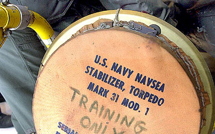 Team members work during a Conventional Weapons Training Proficiency Inspection.