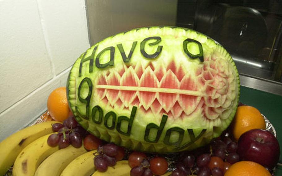 A message carved into a watermelon greets patrons of the Camp Jackson Dining Facility.