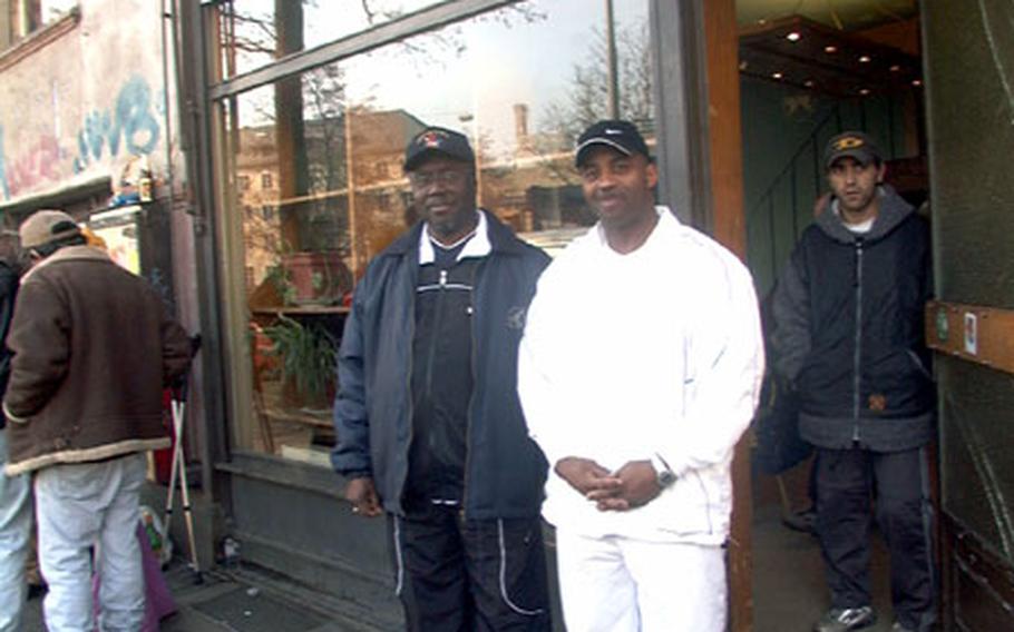 Army Master Sgt. Michael Walker (right) is a regular Friday volunteer at "Die Teestub," a food kitchen in Wiesbaden, Germany. Walker and other members of the New Hope Missionary Baptist Church, including its pastor, Joe Freeman (left), prepare "breakfast" for the needy. Usually, it&#39;s soup and sandwiches. A small homeless shelter adjoins the popular food kitchen. The experience, Walker said, "makes you appreciate who you are and where you come from."
