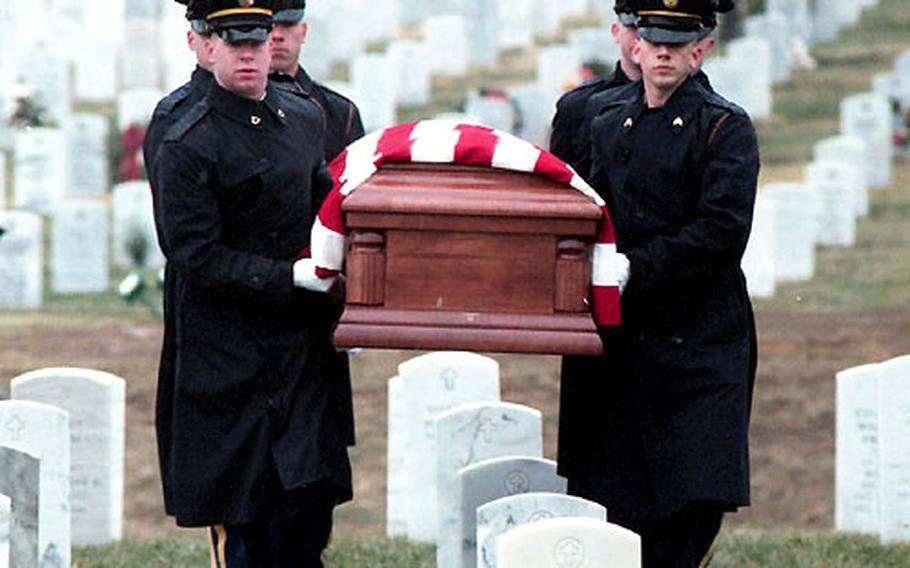 An honor guard from the Army's 3rd U.S. Infantry Regiment carries Bill Mauldin's casket to his grave Wednesday at Arlington National Cemetery.