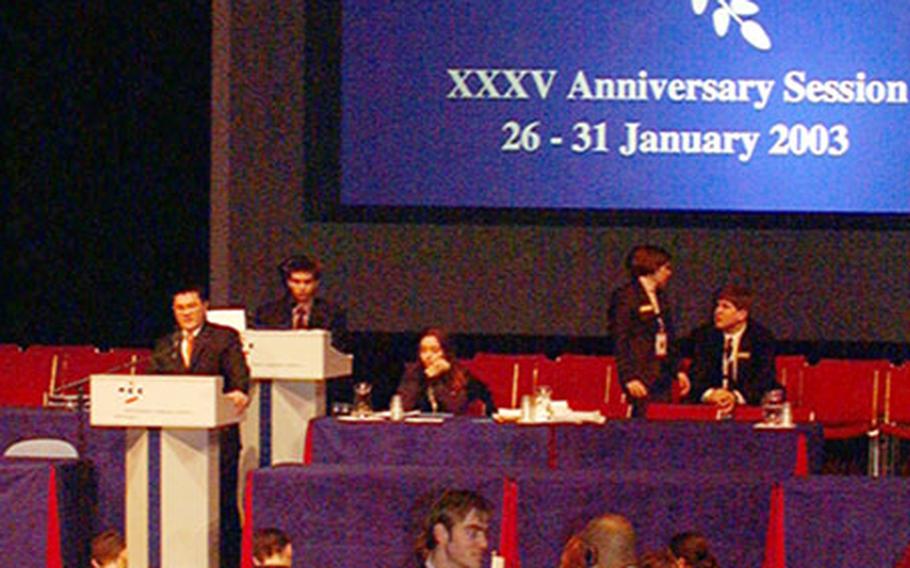 Delegates took to the stage Tuesday to make brief opening remarks at the opening session of the General Assembly for The Hague International Model United Nations. More than 3,100 high school students from 106 countries attended this week's annual conference, now in its 35th year.