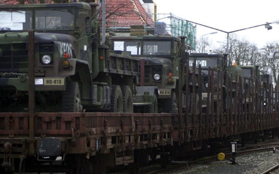 1st Infantry Division soldiers load rail cars with gear and equipment bound for Turkey on Friday.