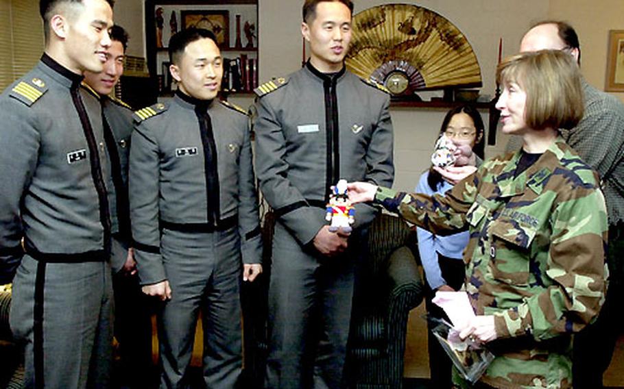 Four South Korean Army Military Academy cadets meet with U.S. Air Force Col. Ruth Ellis in her home Thursday at Yongsan Garrison. More than 200 cadets were invited into U.S. military officers’ homes to exchange leadership ideas while getting to know each other.