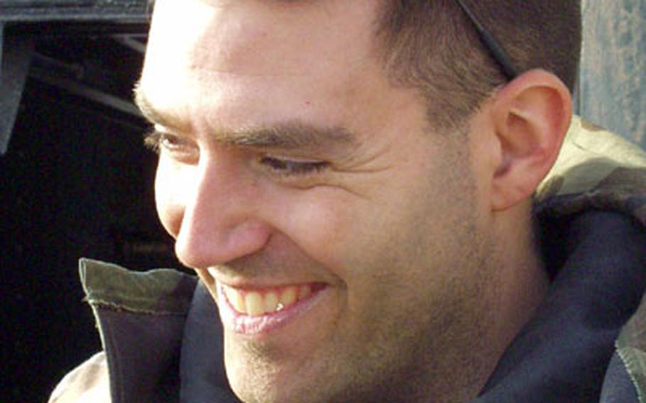 Capt. John Kolisnyk, 29, of Langhorne, Pa., treated two 3rd Infantry Division soldiers who were injured by a rocket-propelled grenade shot by Iraqi irregulars outside An Nasiriyah.