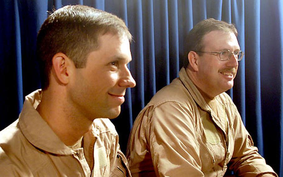 On the USS Kitty Hawk, two aviators from Fighter Squadron 154 talk about ejecting from their F-14A Tomcat over Iraq on Wednesday. The two didn't want their names released. The Black Knights squadron is based at Atsugi Naval Air Facility, Japan.