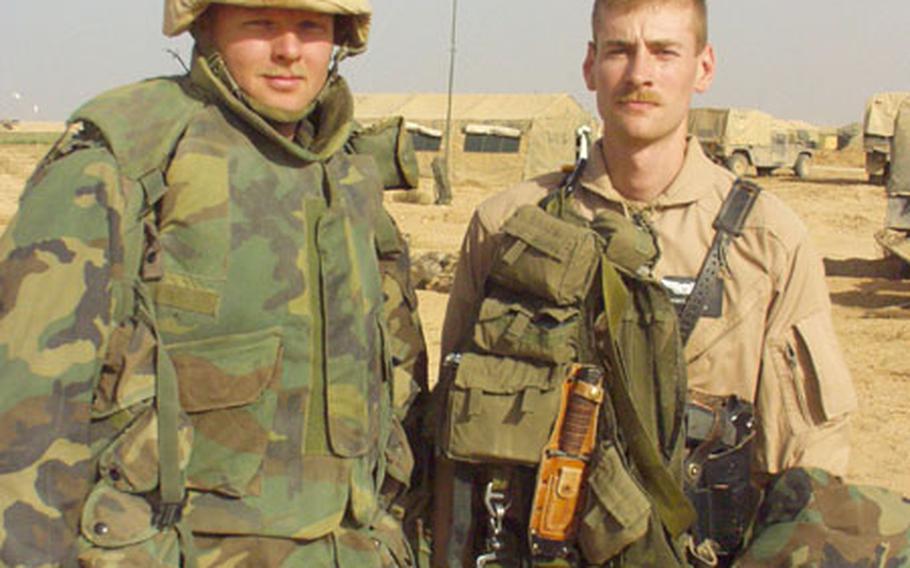 Chief Warrant Officer 2 William B. Smith, 34, of Clarksville, Tenn., (left) and 1st Lt. Nathan Schmidt, 25, of Virginia Beach, Va., scored the first kills for the 6th Squadron, 6th Cavalry Regiment on Wednesday night, wiping out a group of Iraqis who had been firing at 3rd ID positions. The unit, from Illesheim, Germany, has repaired some of its battle-damaged aircraft and is flying patrols, ready to take out Iraqi fedayeen in the 3rd Infantry Division&#39;s rear.